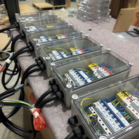 Batch of EVT45 pre-built electrical enclosures ready for pillar installation